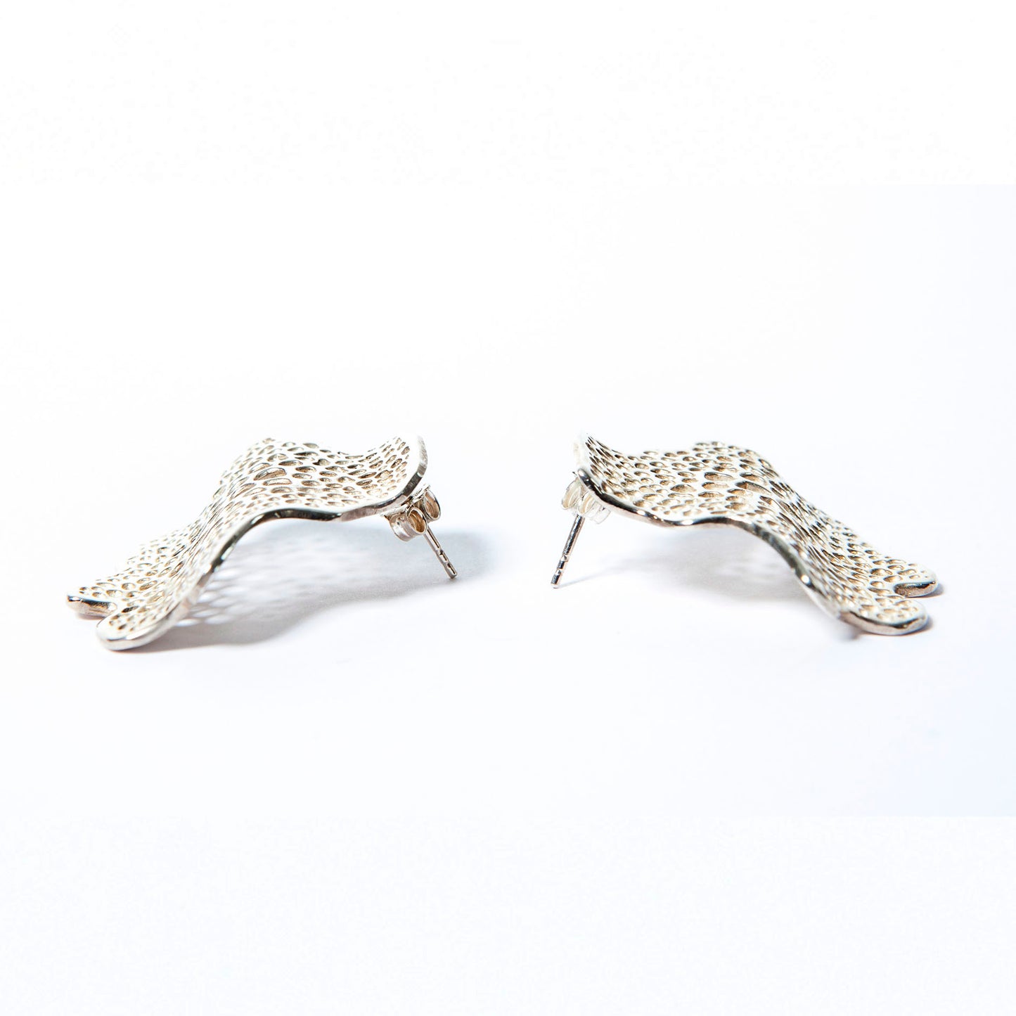 Labyrinth Silver Wave Statement Earrings
